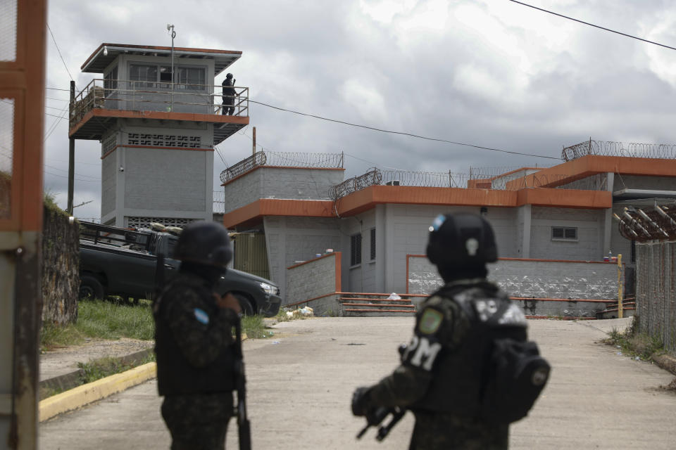 Military police guard the entrance to the National Penitentiary Center in Tamara, on the outskirts of Tegucigalpa, Honduras, Tuesday, June 26, 2023. Honduran President Xiomara Castro has put the military police in charge of the country's prisons. (AP Photo/Elmer Martinez)