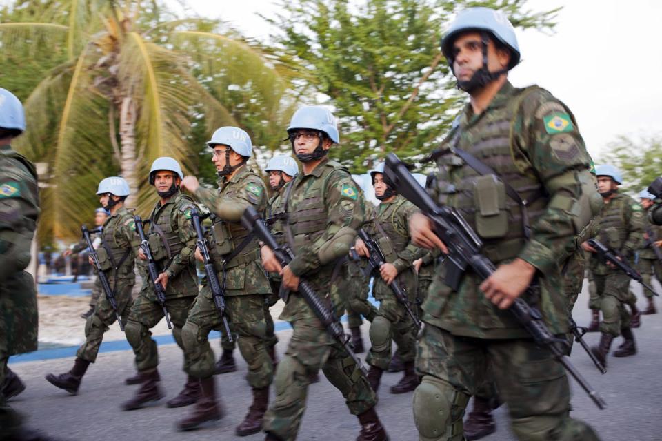 <span class="caption">United Nations peacekeepers from Brazil are seen during a parade in Port-au-Prince, Haiti, in August 2017, two months before the mission ended.</span> <span class="attribution"><span class="source">(AP Photo/Dieu Nalio Chery)</span></span>