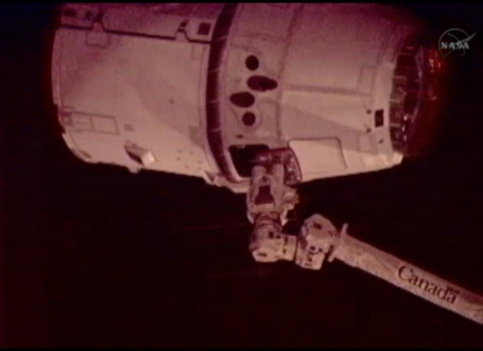 SpaceX Dragon capsule finally docked at the International Space Station over Australia at 9:56 a.m. ET. The capsule was captured by a <a href="http://www.reuters.com/article/2012/05/24/usa-spaceship-idUSL1E8GOHM320120524" target="_hplink">58-foot long robotic arm</a> attached to the station, which will reel in the capsule and its cargo of about <a href="http://www.reuters.com/article/2012/05/24/usa-spaceship-idUSL1E8GOHM320120524" target="_hplink">1,200 lbs of food, water, clothing and supplies</a>.