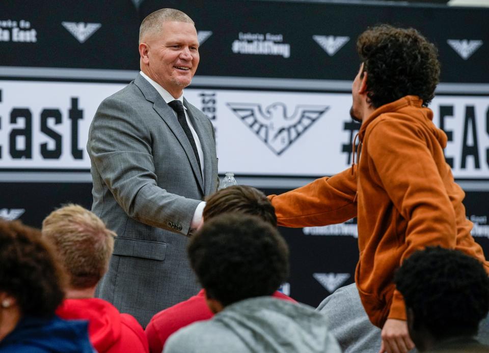 Former Cincinnati Bengals quarterback Jon Kitna meets students at Lakota East High School Wednesday February 22, 2023 before he is officially announced as the new head football coach.
