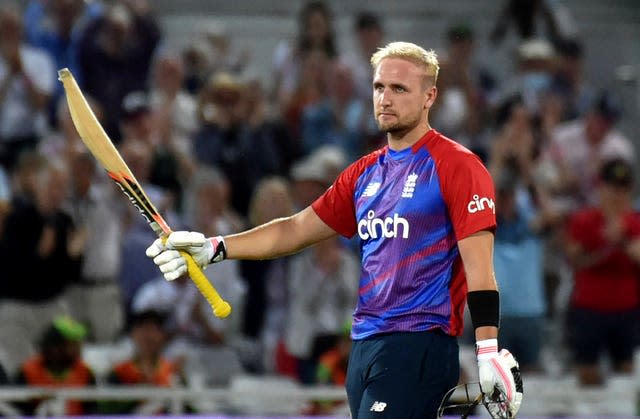 Liam Livingstone raises his bat to celebrate scoring a century