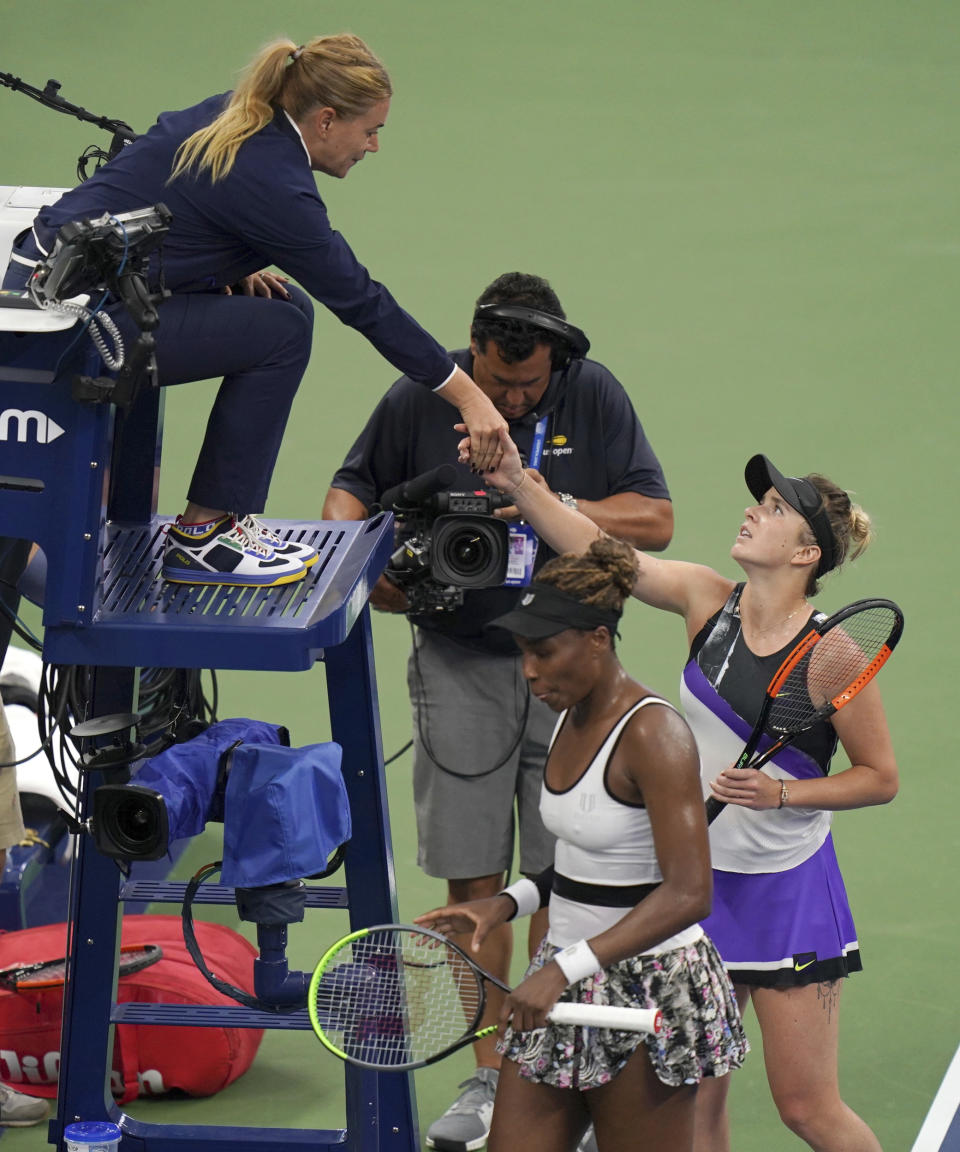 Elina Svitolina, of Ukraine, greets the chair umpire after defeating Venus Williams, of the United States, in the second round of the US Open tennis championships Wednesday, Aug. 28, 2019, in New York. (AP Photo/Michael Owens)