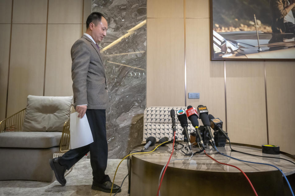 Chinese scientist He Jiankui arrives to speak at a brief press conference in Beijing, Tuesday, Feb. 21, 2023. He, a Chinese scientist who set off an ethical debate five years ago with claims that he made the world’s first genetically edited babies, said Tuesday that he hopes to research rare hereditary diseases in Hong Kong. (AP Photo/Mark Schiefelbein)