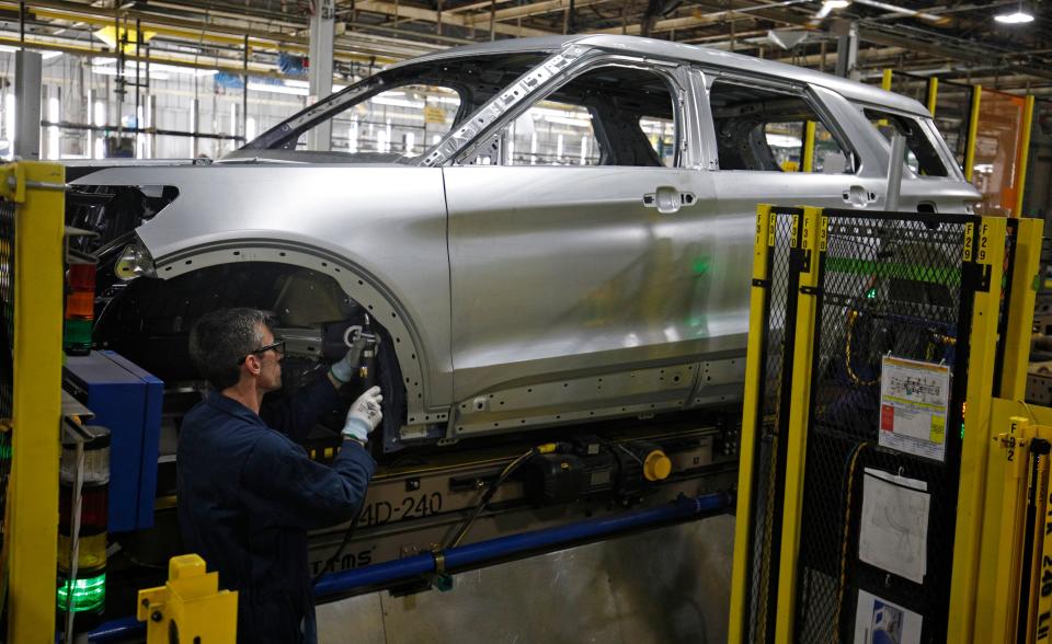 Workers assemble cars at the newly renovated Ford's Assembly Plant in Chicago, June 24, 2019. - The plant was revamped to build the Ford Explorer, Police Interceptor Utility and Lincoln Aviator. (Photo by JIM YOUNG / AFP)        (Photo credit should read JIM YOUNG/AFP via Getty Images)