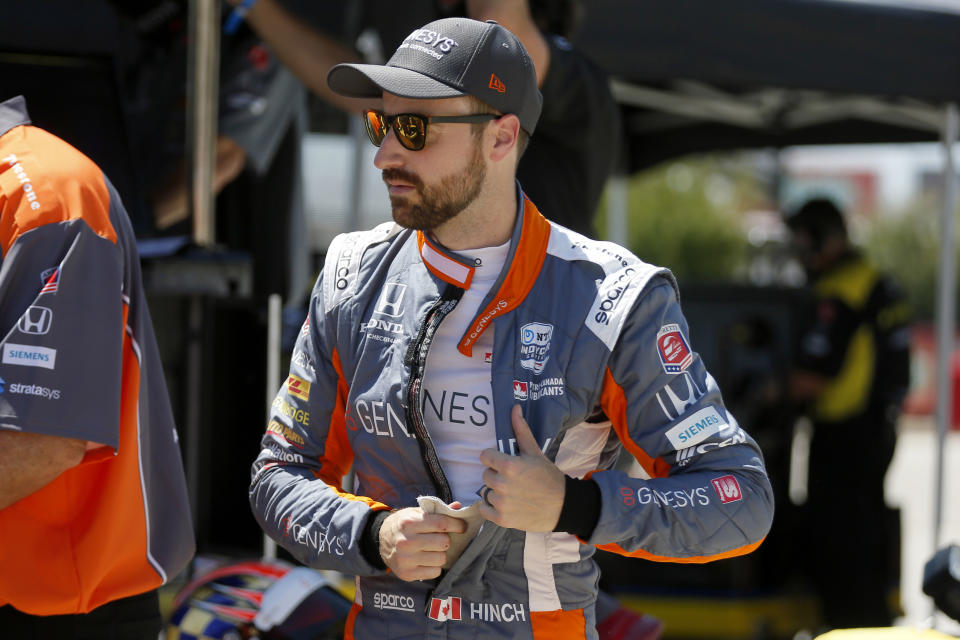 FILE- In this June 6, 2020, file photo, James Hinchcliffe prepares for practice at the IndyCar auto race at Texas Motor Speedway in Fort Worth, Texas. Hinchcliffe will return to Andretti Autosport for the final three races of the season to fill the seat left vacant when Zach Veach stepped out of the car earlier this week, Andretti Autosport announced Friday, Sept. 25, 2020. (AP Photo/Tony Gutierrez, File)