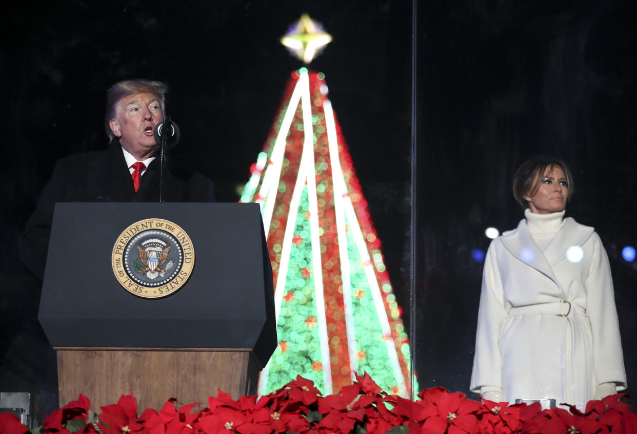 President Donald Trump speaks as first lady Melania Trump looks on during the National Christmas Tree lighting ceremony held by the National Park Service at the Ellipse near the White House on Nov. 28, 2018 in Washington, D.C. (Photo: Pool-Oliver Contreras/Getty Images)