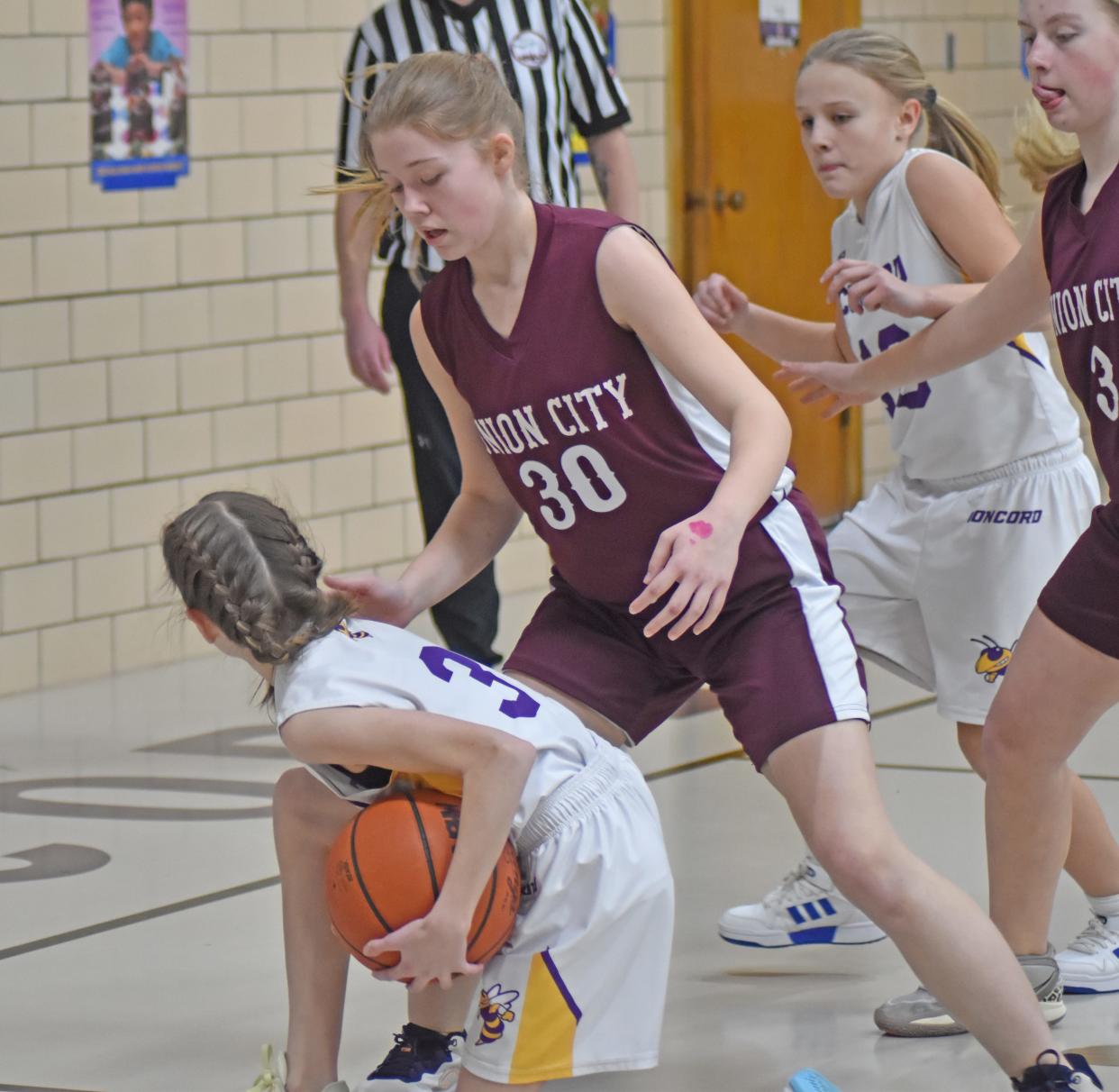 Union City's Ellyse Flynn looks to battle for a loose ball Monday versus Concord.