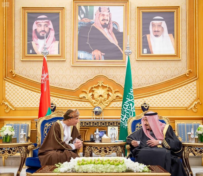 Saudi Arabia's King Salman bin Abdulaziz Al Saud meets Oman's Deputy Prime Minister, Fahad bin Mahmood during the Gulf Cooperation Council's (GCC) 40th Summit in Riyadh