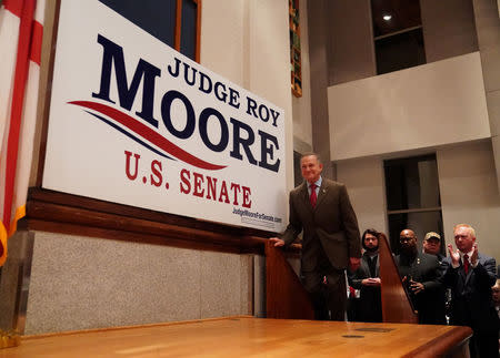 Republican U.S. Senate candidate Roy Moore takes the stage upon arriving at his election night party in Montgomery, Alabama, U.S., December 12, 2017. REUTERS/Carlo Allegri