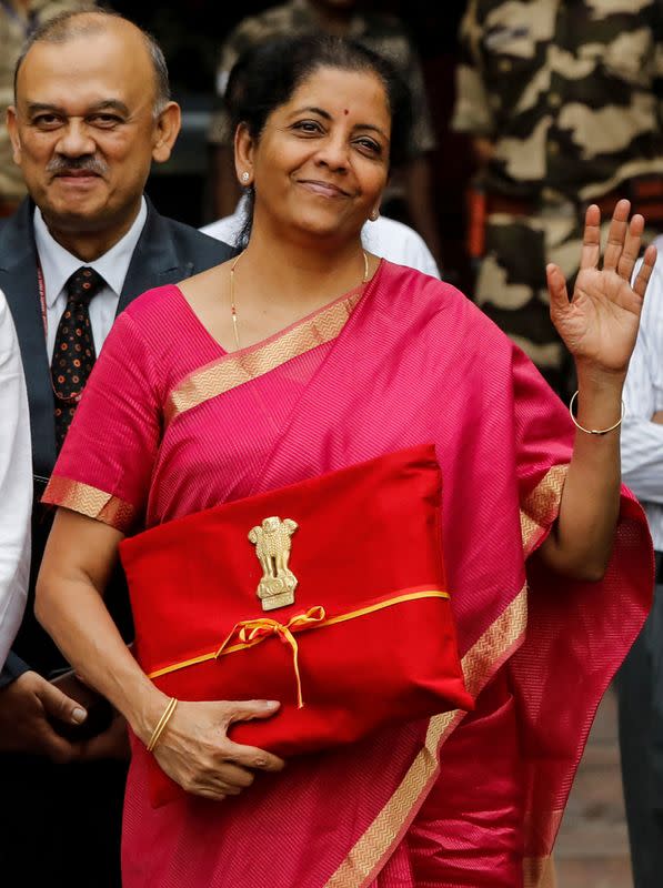 FILE PHOTO: India's Finance Minister Nirmala Sitharaman gestures during a photo opportunity as she leaves her office to present the federal budget in the parliament in New Delh