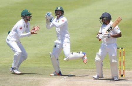 Cricket - South Africa v Sri Lanka - Second Test cricket match - Newlands Stadium, Cape Town, South Africa - 5/1/17 - South Africa's Quinton de Kock appeals unsuccessfully for a catch off Sri Lanka's Rangana Herath. REUTERS/Mike Hutchings