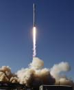 REFILE - ADDING ADDITIONAL CAPTION INFORMATION A Falcon 9 rocket carrying a small science satellite for Canada is seen as it is launched from a newly refurbished launch pad in Vandenberg Air Force Station September 29, 2013. The unmanned rocket blasted off from California on Sunday to test upgrades needed for planned commercial launch services. The 22-story rocket, built and flown by Space Exploration Technologies, or SpaceX, soared off a newly refurbished, leased launch pad at Vandenberg Air Force Station at noon EDT/1600 GMT (05.00 p.m. British time). REUTERS/Gene Blevins (UNITED STATES - Tags: SCIENCE TECHNOLOGY)