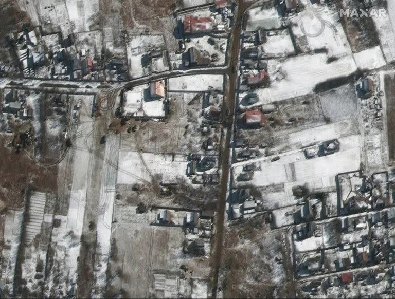 This satellite image provided by Maxar Technologies shows troops and military vehicles deployed in Ozera, Ukraine, northeast of Antonov Airport, during the Russian invasion, Thursday, March 10, 2022. (Satellite image &#xa9;2022 Maxar Technologies via AP)