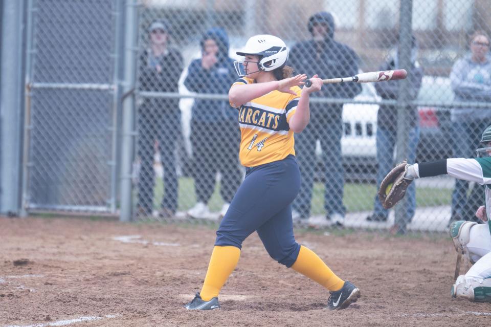 Battle Creek Central junior Olivia Johnson swings at a pitch during a game against Pennfield at Battle Creek Central High School on Thursday, April 4, 2024.