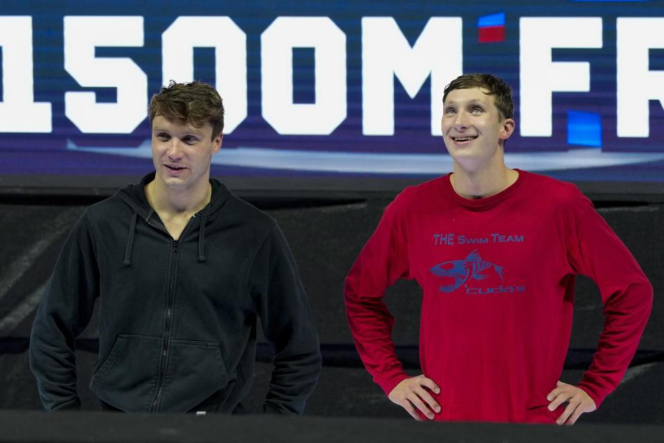 Robert Finke and David Johnston react after the Men's 1500 freestyle finals Sunday, June 23, 2024, at the US Swimming Olympic Trials in Indianapolis. (AP Photo/Michael Conroy)
