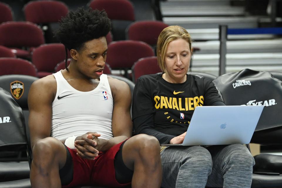 Cleveland Cavaliers guard Collin Sexton (2) works with assistant coach Lindsay Gottlieb before a game against the Indiana Pacers on Feb. 29, 2020, in Cleveland.