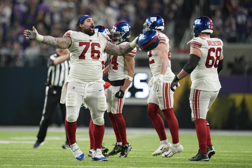 New York Giants players celebrate after the Minnesota Vikings failed to get a first down during the second half of an NFL wild card football game Sunday, Jan. 15, 2023, in Minneapolis. The Giants won 31-24. (AP Photo/Abbie Parr)