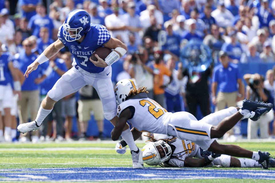 Kentucky quarterback Will Levis (7) gets tackled by Chattanooga defensive back Telly Plummer (29) during the second half of their NCAA college football game in Lexington, Ky., Saturday, Sept. 18, 2021. (AP Photo/Michael Clubb)