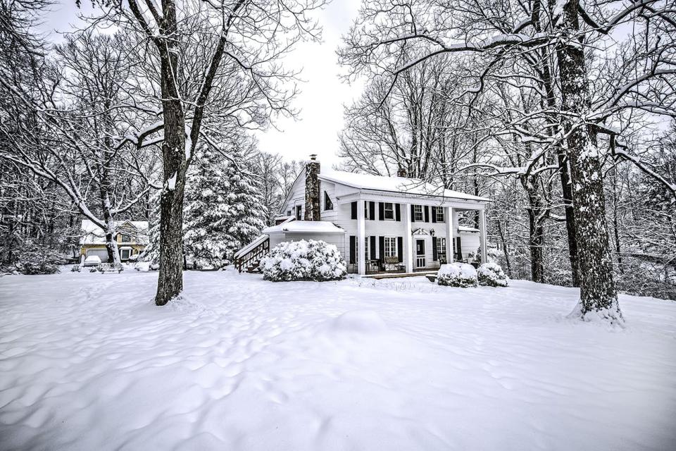 neat old house after snowfall, in Tennessee