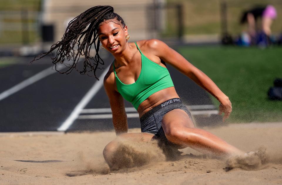Jaida Bell warms up on the Long Jump during track practice at Johnston High School, Monday, April 15, 2024.