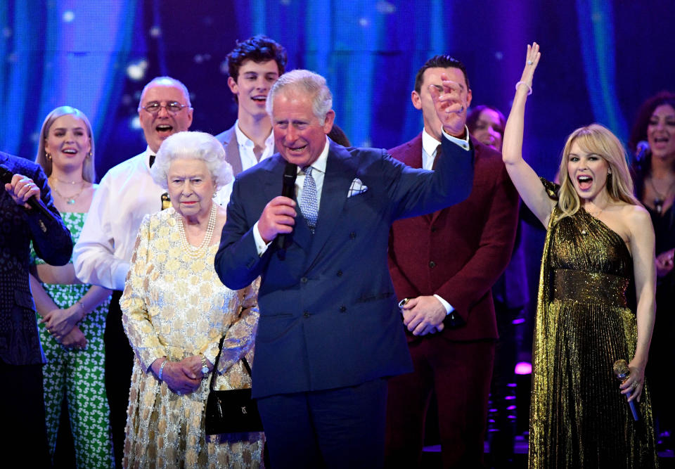 The Queen appears stony-faced behind Prince Charles (Picture: PA)