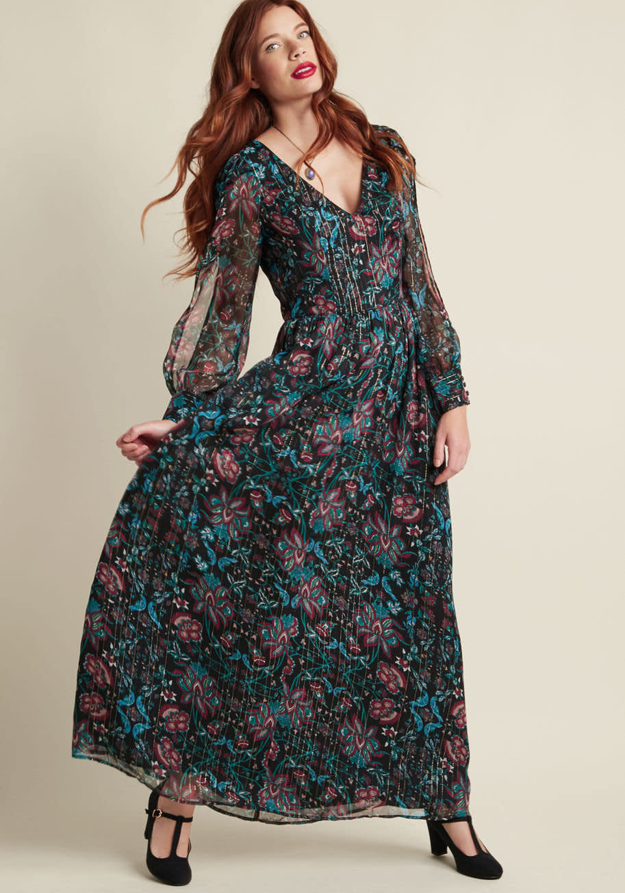 Shop it <strong><a href="https://www.modcloth.com/shop/maxi-dresses/loop--twirl--and-arch-maxi-dress-in-black/153142.html?cgid=maxi_dresses_117&amp;dwvar_153142_color=BLKFL" target="_blank">here</a></strong>.