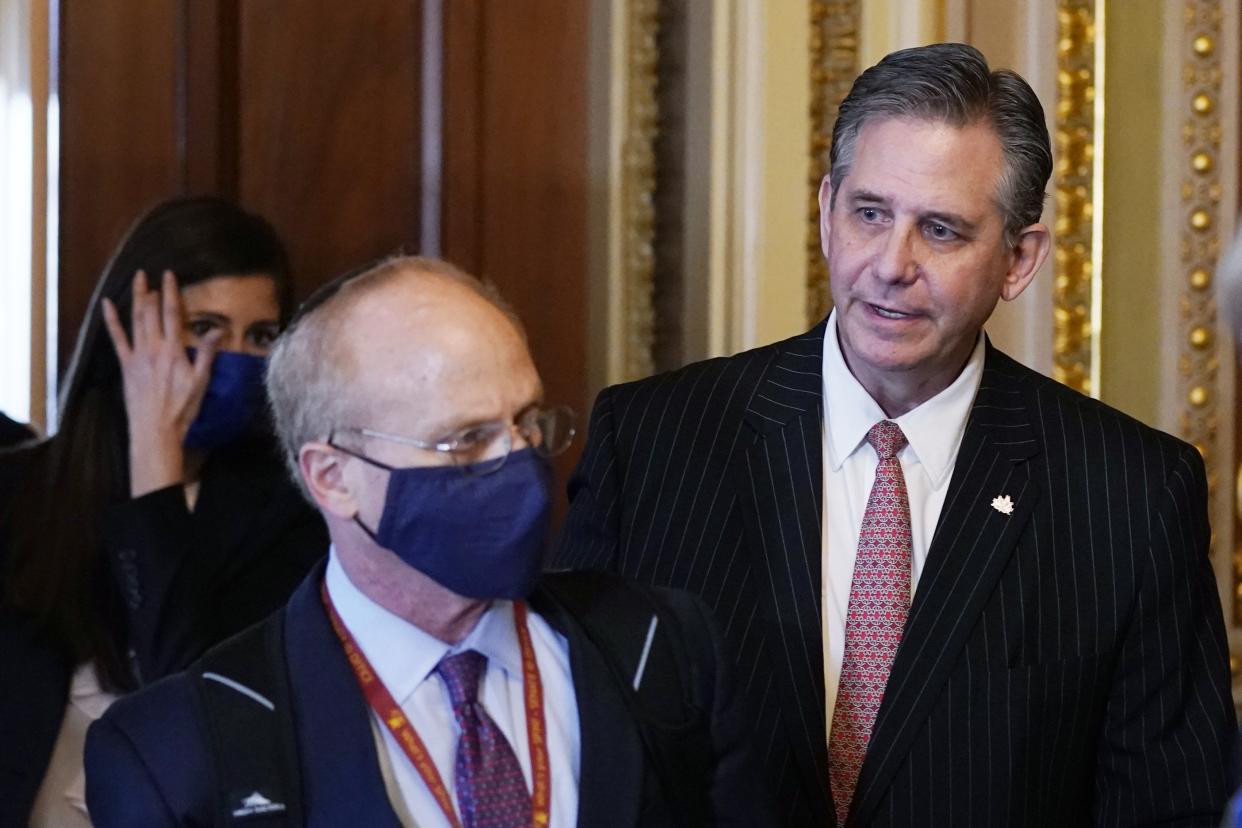 David Schoen, left, and Bruce Castor, center, lawyers for former President Donald Trump, arrives for the second impeachment trial of Trump in the Senate on Tuesday.