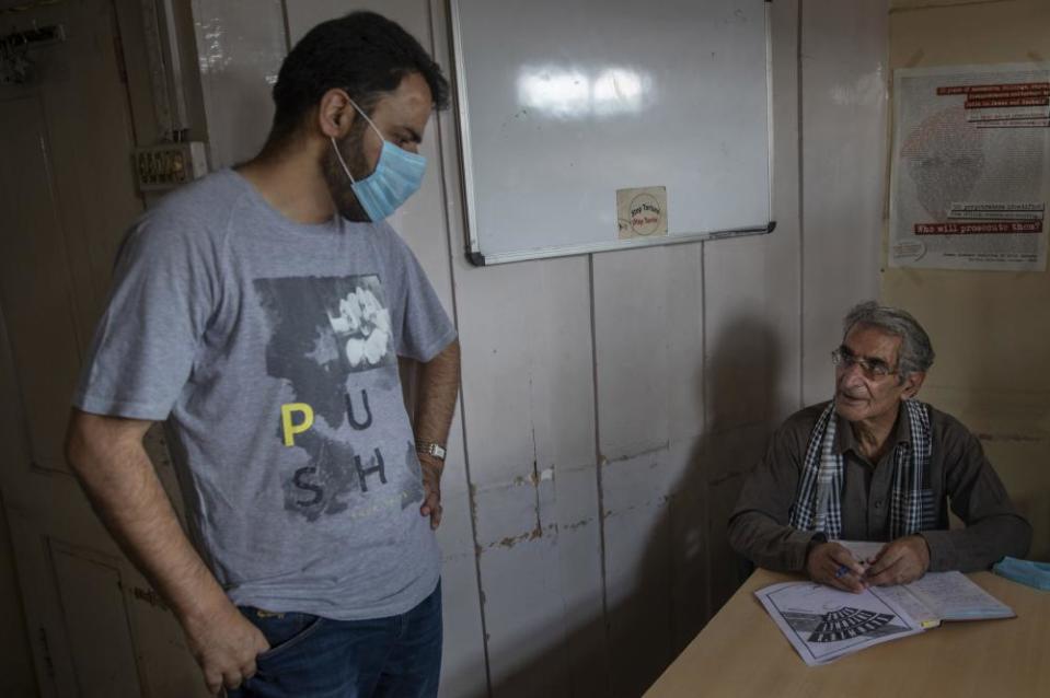 Khurram Parvez, left, before his arrest with the human rights lawyer Parvez Imroz in Srinagar, Indian-controlled Kashmir.