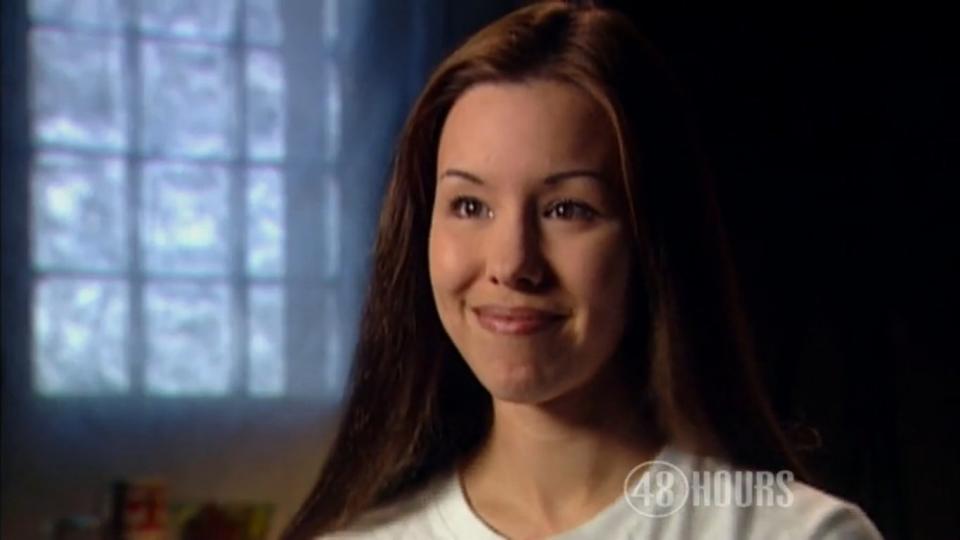 <strong>June 23, 2009</strong> – Following her arrest, Arias expanded on her second story about the day of Alexander's death. <a href="http://www.cbsnews.com/video/watch/?id=50139320n" target="_hplink">In an interview with "48 Hours,"</a> she admitted that she was present when he was murdered, but she said that his death occurred during a home invasion. Arias reported that the two were having fun playing with his new camera when things took a sudden turn.  "I heard a really loud pop. And the next thing I remember, I was lying next to the bathtub and Travis was screaming," Arias told "48 Hours." "At that point, I sort of was just trying to come around and kind of orientate myself to what was going on," she continued. "And I looked up and I just -- I saw two other individuals in the bathroom. And they were both coming toward us."  The intruders, whom she described as a man and a woman dressed in black, were armed with a knife and a gun. At one point, she said, the man pointed the gun at her, but she was miraculously spared.  "He pulled the trigger. And nothing happened with the gun. And so I just grabbed my purse, which was on the floor at that point, and I ran down the stairs and out of there and I left [Travis] there ... I pushed past him and -- and his gun. And I just didn't look back."  Arias said that she kept driving and never called the police.  "It was -- I was terrified. And I was scared for my life. And I think there was a naive belief that I could pretend like it didn't really happen," Arias said.