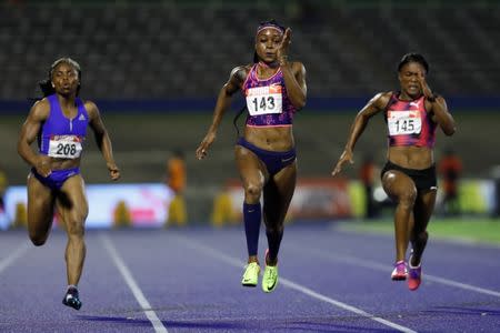 Athletics - JAAA National Senior Championships - National Stadium Kingston, Jamaica - June 23, 2017 Jamaica's Jura Levy (L-R), Elaine Thompson, and Christania Williams in action during the Women's 100m final REUTERS/Lucy Nicholson