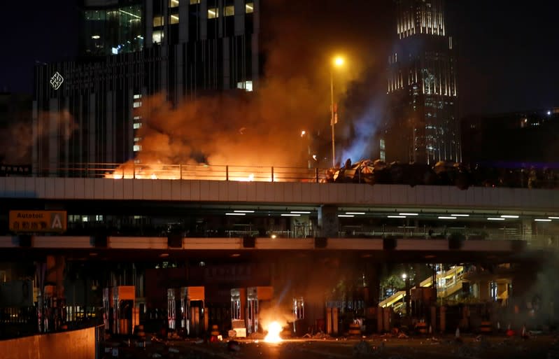 Protesters clash with police outside Hong Kong Polytechnic University (PolyU) in Hong Kong