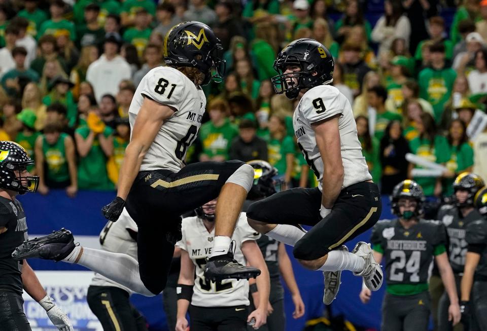 Mt. Vernon Marauders George Burhenn (81) celebrate with Mt. Vernon Marauders Eli Bridenthal (9) after a touchdown during the IHSAA Class 4A State Finals on Saturday, Nov. 27, 2021, at Lucas Oil Stadium in Indianapolis. Mt. Vernon Marauders defeated the Northridge Raiders, 45-14. 