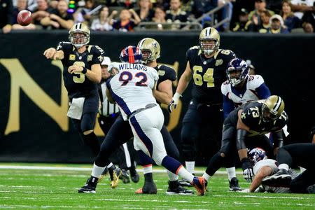 Nov 13, 2016; New Orleans, LA, USA; New Orleans Saints quarterback Drew Brees (9) throws as Denver Broncos nose tackle Sylvester Williams (92) pressures during the fourth quarter of a game at the Mercedes-Benz Superdome. The Broncos defeated the Saints 25-23. Mandatory Credit: Derick E. Hingle-USA TODAY Sports