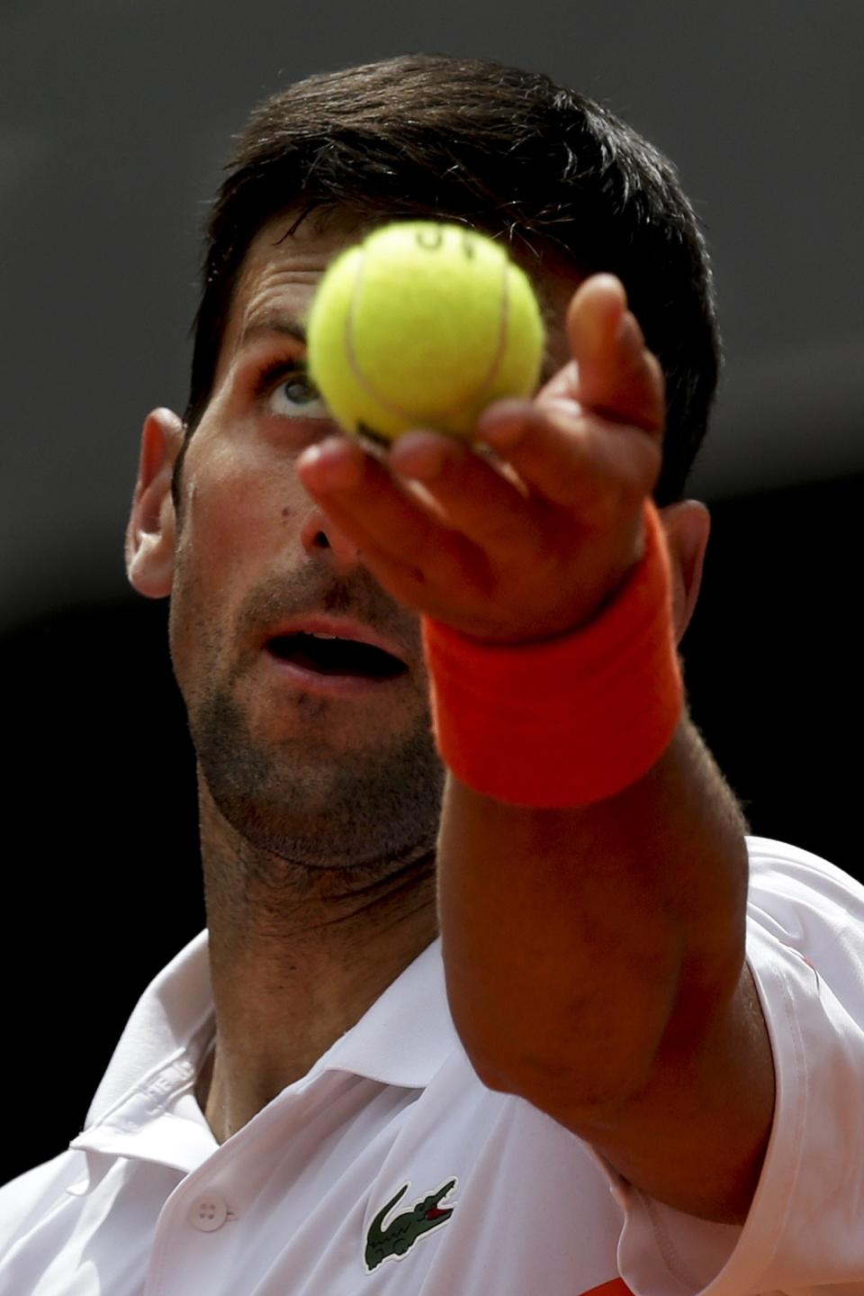 Novak Djokovic, from Serbia, serves to Taylor Fritz, from United States during the Madrid Open tennis tournament in Madrid, Tuesday, May 7, 2019. (AP Photo/Bernat Armangue)