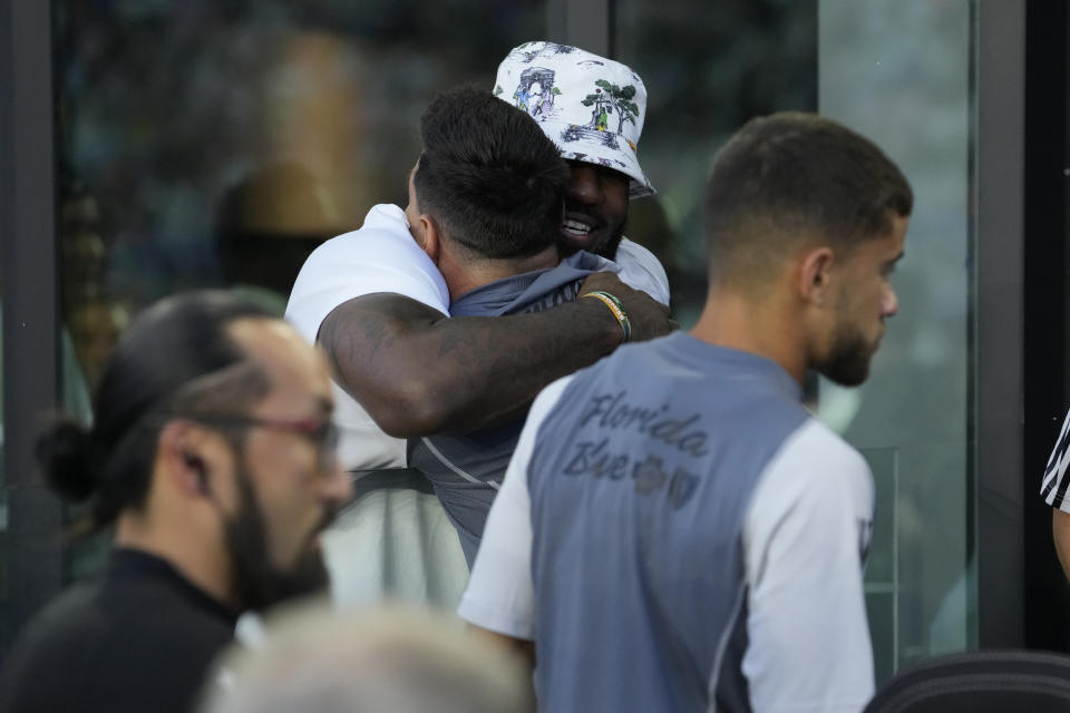 LA Lakers' LeBron James hugs Inter Miami forward Lionel Messi before a Leagues Cup soccer match against Cruz Azul, Friday, July 21, 2023, in Fort Lauderdale, Fla. (AP Photo/Lynne Sladky)