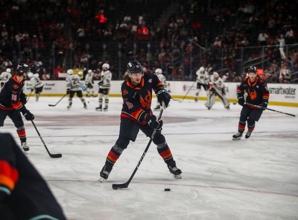 Coachella Valley forward John Hayden (15) takes a shot during warmups before Game 2 of the Calder Cup Finals at Acrisure Arena in Palm Desert, Calif., Saturday, June 10, 2023.