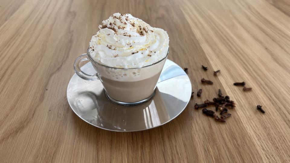 pumpkin spice latte on wooden worktops