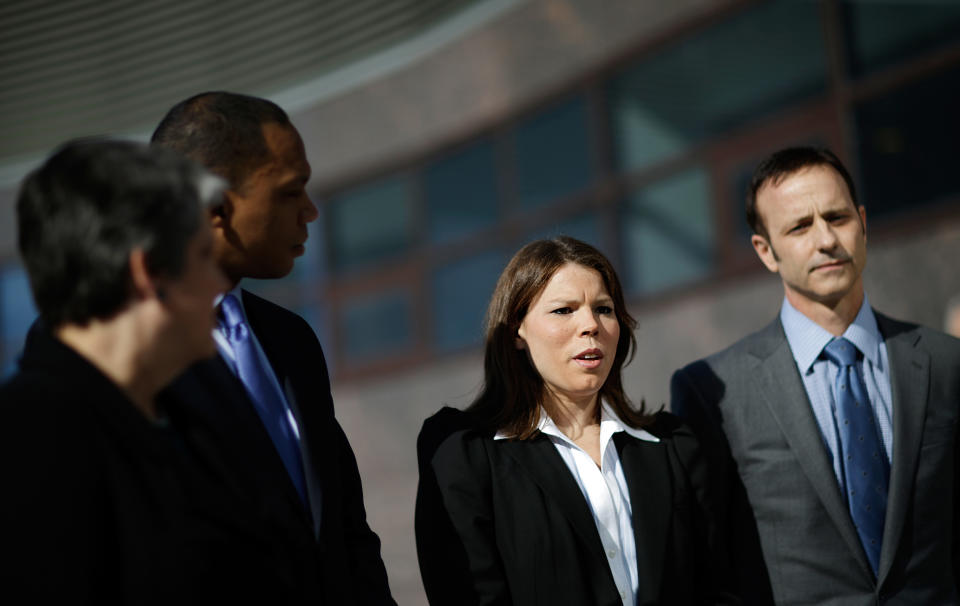 Former United States hockey player Caitlin Cahow, second from right, speaks during a news conference with fellow members of the U.S. delegation, from left, former Homeland Security Secretary Janet Napolitano and current President of the University of California, Assistant to the President and Deputy Chief of Staff for Policy Robert Nabors, and Olympic gold medal figure skater Brian Boitano, ahead of the opening ceremony at the 2014 Winter Olympics, Friday, Feb. 7, 2014, in Sochi, Russia. (AP Photo/David Goldman)