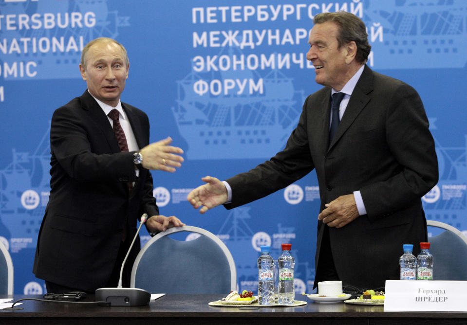 Russian President Vladimir Putin, left, and Germany's former Chancellor Gerhard Schroeder attend an economic forum in St.Petersburg, Russia, Thursday, June 21, 2012. Gerhard Schroeder left the German chancellery after a narrow election defeat in 2005 with an ambitious overhaul of the country’s welfare state beginning to kick in and every chance of becoming a respected elder statesman. Fast-forward to last week: German lawmakers agreed to shut down Schroeder’s taxpayer-funded office, the European Parliament called for him to be sanctioned, and his own party set a mid-June hearing on applications to have him expelled. Schroeder’s association with the Russian energy sector turned the 78-year-old into a political pariah in Germany after the invasion of Ukraine. (AP Photo/Dmitry Lovetsky, pool)