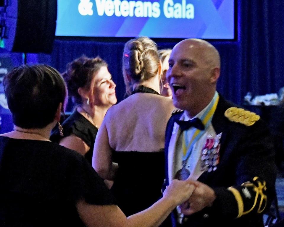 Col. Bryan Fowler, state inspector general for the Michigan National Guard and his wife, Phillica Fowler, dance at the Military & Veterans Gala on Nov. 4, 2023, at the Suburban Collection Showplace in Novi.