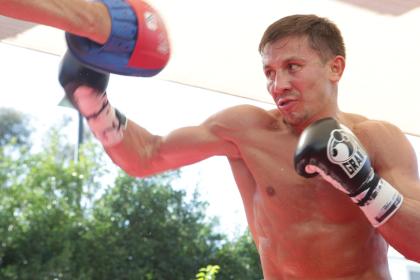Gennady Golovkin hits the mitts with his trainer Abel Sanchez during an open media workout. (Getty Images)