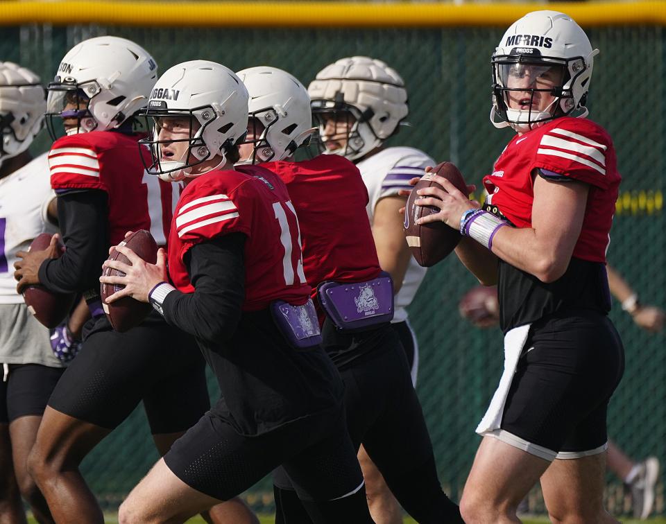 December 27, 2022; Scottsdale, Ariz; USA; TCU quarterbacks Max Duggan (L) and Chandler Morris (R) throw passes during a practice prior to the Fiesta Bowl at Notre Dame Prep High School.