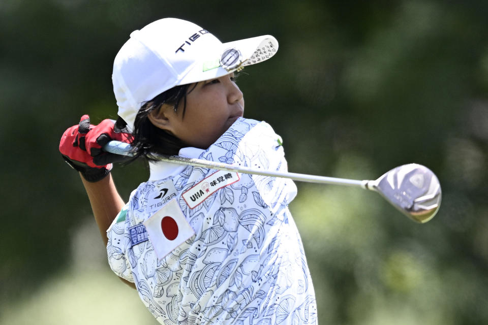 Miroku Suto of Japan follows through on her tee shot on the seventh hole during the final round at the Junior World Championships golf tournament held at Singing Hills Golf Resort on Thursday, July 14, 2022, in El Cajon, Calif. (AP Photo/Denis Poroy)