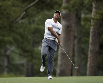 Tiger Woods reacts to his shot on the 14th hole during the first round of the Masters. (AP)