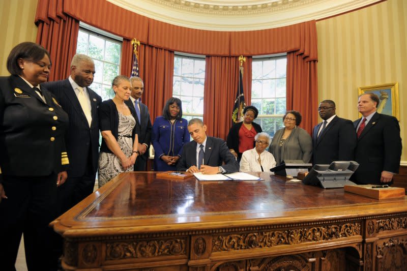 President Barack Obama signs a bill in the Oval Office on May 24, 2013, designating the Congressional Gold Medal commemorating the lives of the four young girls killed in the 16th Street Baptist Church Bombings of 1963 in Birmingham, Ala. On May 1, 2001, a former member of the Ku Klux Klan was convicted in Birmingham, Ala., for the bombing. He was given four life sentences. File Photo by Mike Theiler/UPI