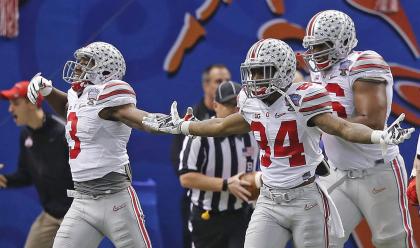 Ohio State players celebrates touchdown by running back Ezekiel Elliott in the second half of the Sugar Bowl NCAA college football playoff semifinal game against Alabama, Thursday, Jan. 1, 2015, in New Orleans. (AP Photo/Bill Haber)