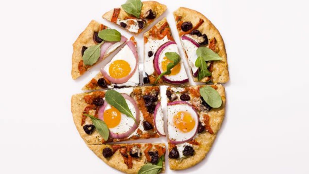 <p>Misha Gravenor</p><p>Breakfast heads down to the Mediterranean with this zesty morning pizza.</p><p><strong>Get the recipe: <a href="/29835/dash/pizza-with-eggs-roasted-peppers-and-olives/" data-ylk="slk:Pizza with Eggs Roasted Peppers and Olives;elm:context_link;itc:0;sec:content-canvas" class="link rapid-noclick-resp">Pizza with Eggs Roasted Peppers and Olives</a></strong></p>