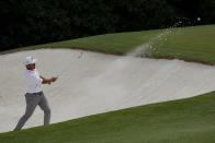 Xander Schauffele hits out of a bunker on the fifth hole during the final round of the Masters golf tournament on Sunday, April 11, 2021, in Augusta, Ga. (AP Photo/Gregory Bull)