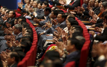 Delegates clap their hands while attending the Closing Ceremony of the 12th National Congress of Vietnam Communist Party in Hanoi, Vietnam January 28, 2016. REUTERS/Kham