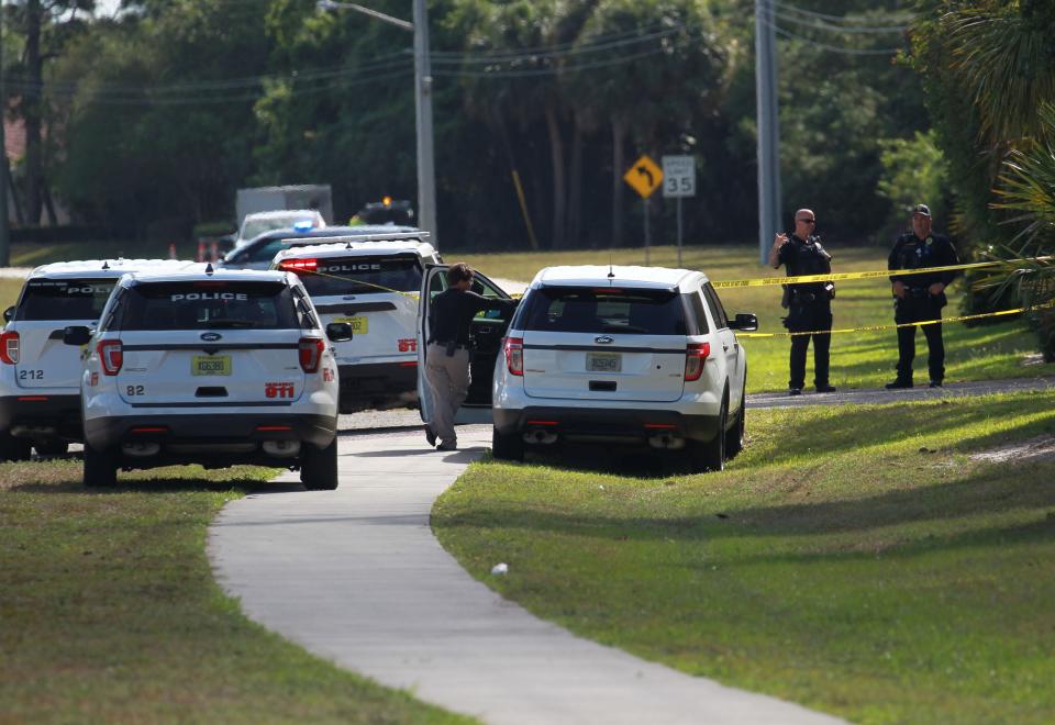 Port St. Lucie Police are seen along Southwest Tulip Boulevard near Treasure Coast HIgh School while trying to find a missing 15-year-old girl on Monday, April 11, 2022 in Port St. Lucie. The girl was talking to a friend on her phone wile walking to school  and advised she was being followed by someone.